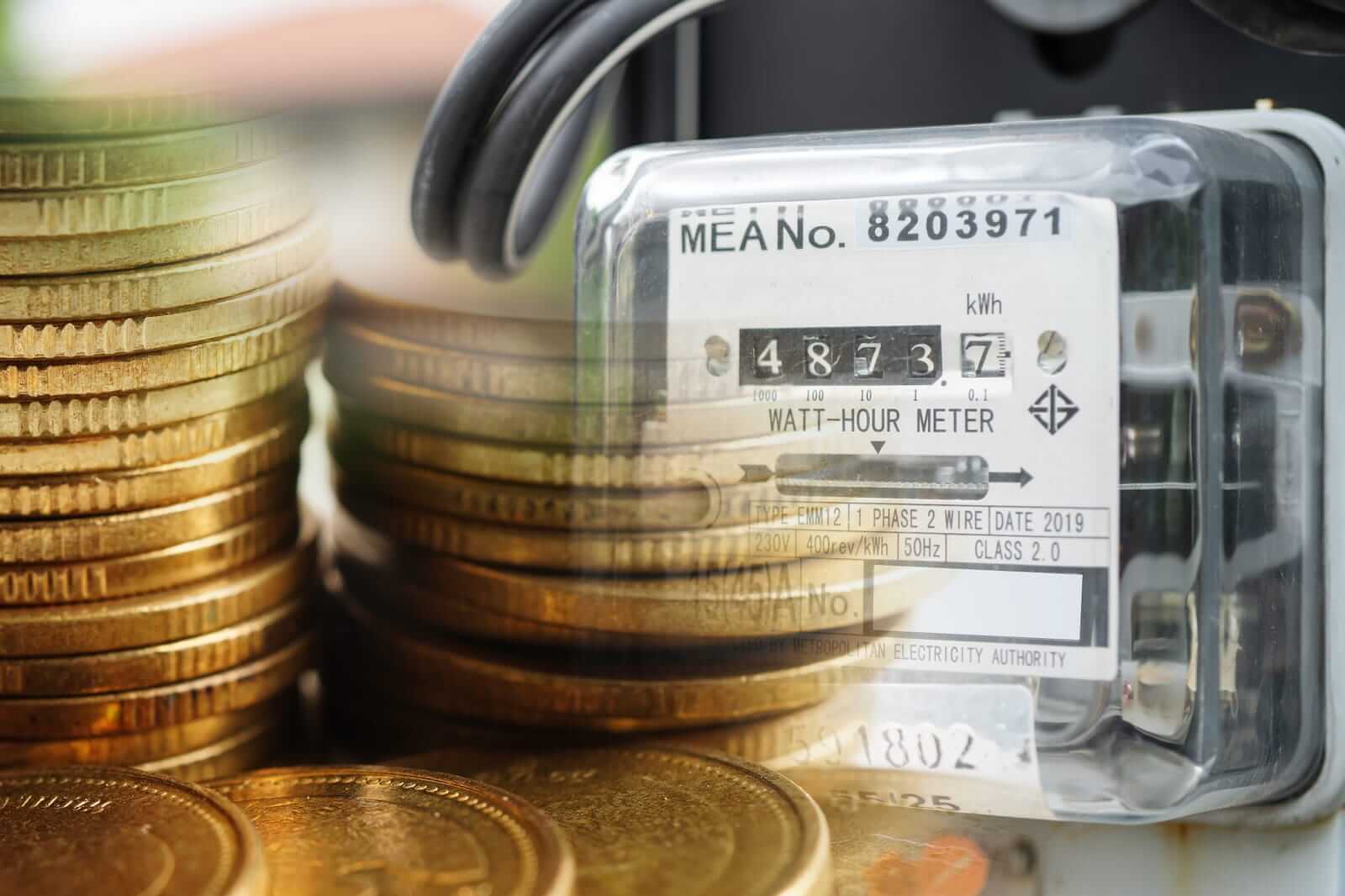 Electricity meter with coins money, Cost expensive fuel energy power bill. (1)